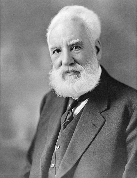 Elderly man with beard in suit portrait.