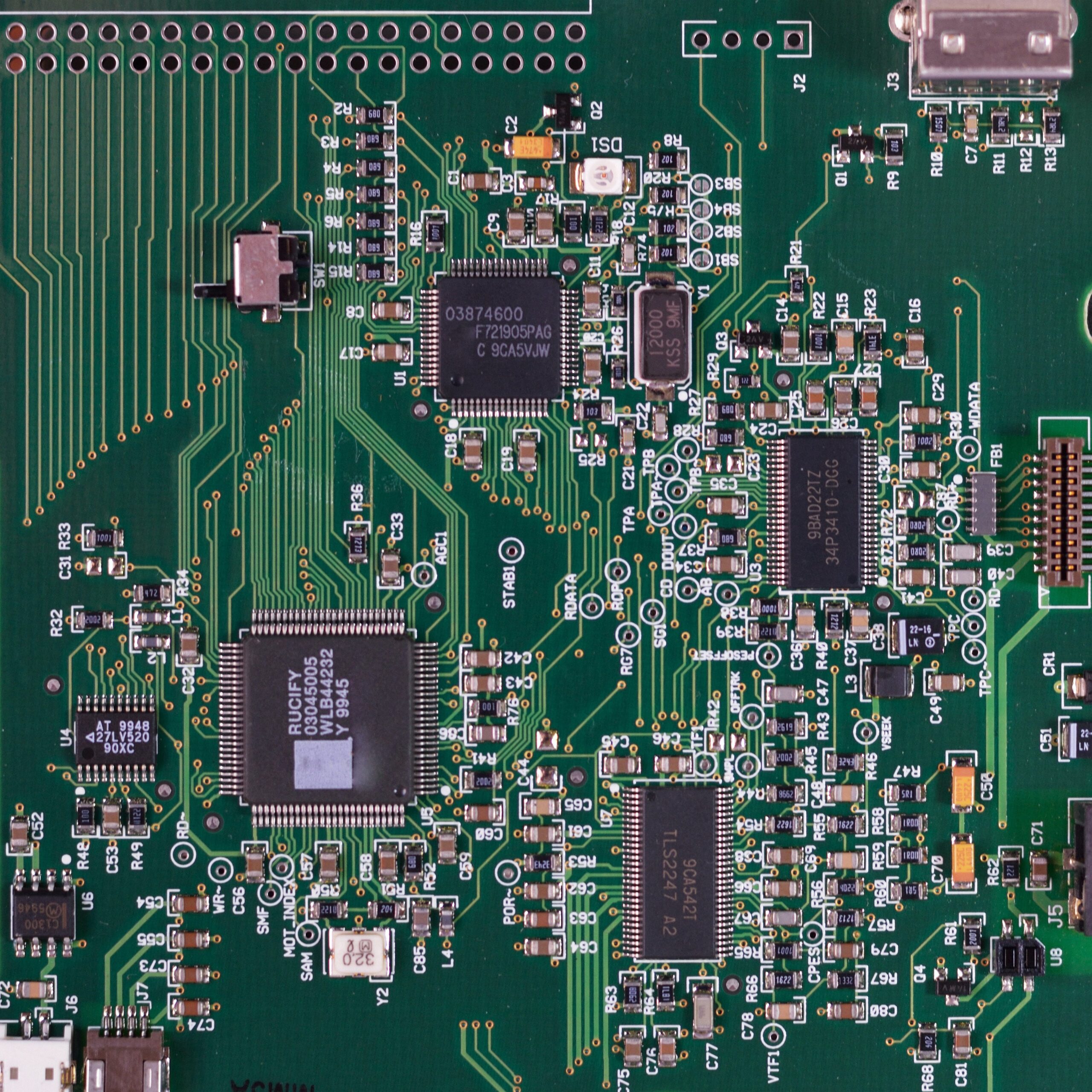 Close-up of a green circuit board.